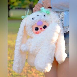 Baby Three Hugging Baby Backpack plush doll.